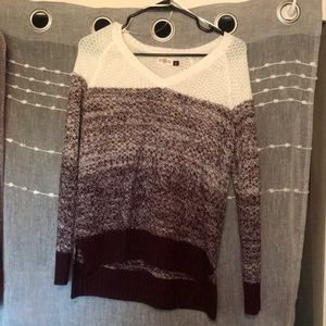 An ombré burgundy sweater